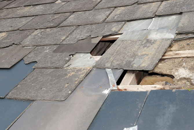 Asbesthoudende leien dak